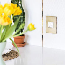 Load image into Gallery viewer, adorne® Energy-Saving On/Off Outlet in living room.
