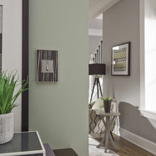 Load image into Gallery viewer, adorne® Real Materials Wall Plate in living room.
