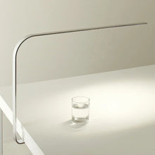 Load image into Gallery viewer, LIM C LED Table Lamp in office.
