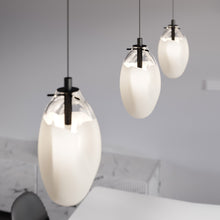 Load image into Gallery viewer, Liquid LED Pendant Light in dining room.
