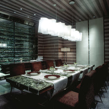 Load image into Gallery viewer, Logico Triple Linear Pendant Light in dining room.
