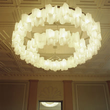 Load image into Gallery viewer, Logico Triple Linear Pendant Light in living room.
