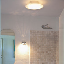 Load image into Gallery viewer, AJ Eklipta Wall Light in bathroom.
