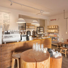 Load image into Gallery viewer, AJ Royal LED Pendant Light in coffee shop.
