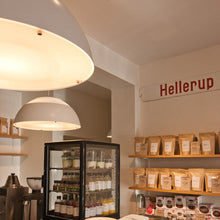Load image into Gallery viewer, AJ Royal LED Pendant Light in coffee shop.
