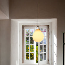 Load image into Gallery viewer, Moser Ø Pendant Light in living room.
