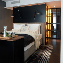 Load image into Gallery viewer, NJP Adjustable LED Wall Light in bedroom.
