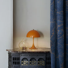 Load image into Gallery viewer, Panthella LED Mini Table Lamp in living room.
