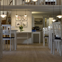Load image into Gallery viewer, PH 2/1 Pendant Light in restaurant.
