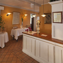 Load image into Gallery viewer, PH 2/1 Pendant Light in restaurant.

