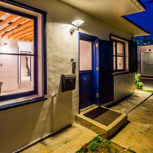 Load image into Gallery viewer, PH 3-2½ Wall Light in Outside Area.
