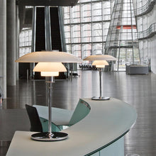Load image into Gallery viewer, PH 4½-3½ Table Lamp in information desk.
