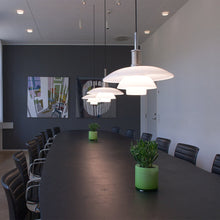 Load image into Gallery viewer, PH 4½-4 Pendant Light in conference room.
