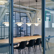 Load image into Gallery viewer, PH 4½-4 Pendant Light in conference room.
