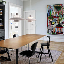 Load image into Gallery viewer, PH 5 Pendant Light in living room.
