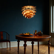 Load image into Gallery viewer, PH Artichoke Pendant Light in dining room.
