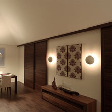 Load image into Gallery viewer, PH Hat Wall Light in living room.
