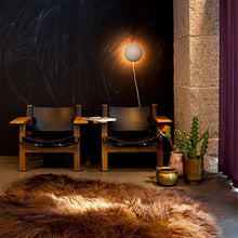 Load image into Gallery viewer, PH Hat Wall Light in living room.
