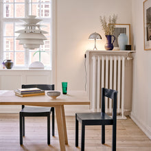 Load image into Gallery viewer, PH Snowball Pendant Light in living room.
