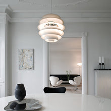 Load image into Gallery viewer, PH Snowball Pendant Light in living room.
