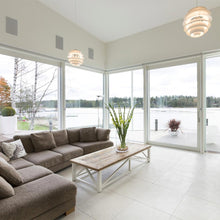 Load image into Gallery viewer, PH Snowball Pendant Light in living room.
