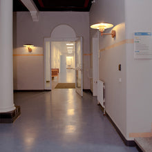 Load image into Gallery viewer, PH Wall Light in hallway.

