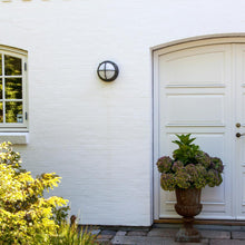 Load image into Gallery viewer, Skot LED Wall Light in Outside Area.
