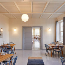 Load image into Gallery viewer, VL Crown Wall Light in Dining Room.
