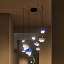 Load image into Gallery viewer, Dipping Light LED Pendant Light in living room.
