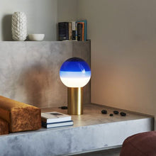 Load image into Gallery viewer, Dipping Light LED Table Lamp in living room.
