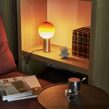 Load image into Gallery viewer, Dipping Light LED Table Lamp in living room.
