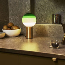 Load image into Gallery viewer, Dipping Light LED Table Lamp in living room.
