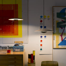 Load image into Gallery viewer, Ginger LED Pendant Light in living room.

