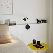 Load image into Gallery viewer, N. Ocho LED Wall Light in living room.
