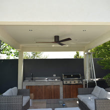Load image into Gallery viewer, Irene IR3H Indoor / Outdoor Flush Mount Ceiling Fan in Outside Area.
