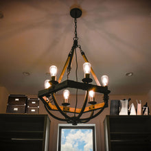 Load image into Gallery viewer, Lodge Chandelier in bedroom.
