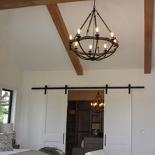 Load image into Gallery viewer, Lodge Chandelier in bedroom.
