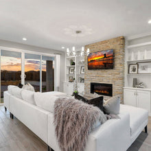 Load image into Gallery viewer, Silo Chandelier in living room.
