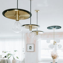 Load image into Gallery viewer, Milo Disc Pendant Light in living room.
