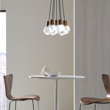 Load image into Gallery viewer, Mina 7-Light LED Pendant Light in office.
