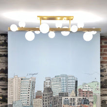 Load image into Gallery viewer, Mini Hinsdale Linear LED Pendant Light in living room.
