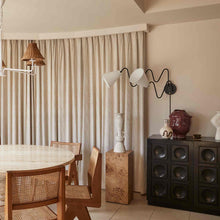 Load image into Gallery viewer, Onda Plug-In Wall Light in dining room.
