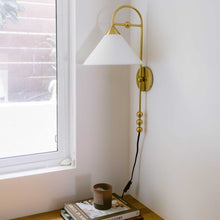 Load image into Gallery viewer, Sang Plug-In Wall Light in office.
