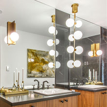 Load image into Gallery viewer, ModernRail LED Pendant Light in bathroom.
