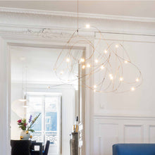 Load image into Gallery viewer, Flock of Light LED Chandelier in living room.
