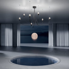 Load image into Gallery viewer, Gravity LED Chandelier in exhibition.

