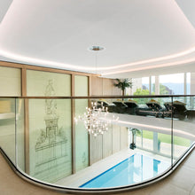 Load image into Gallery viewer, Crown Magnum LED Chandelier in swimming pool.
