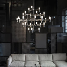Load image into Gallery viewer, Crown Major LED Pendant Light in living room.
