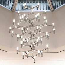 Load image into Gallery viewer, Crown Summa LED Chandelier in living room.
