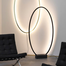 Load image into Gallery viewer, Ellisse Floor Lamp in living room.
